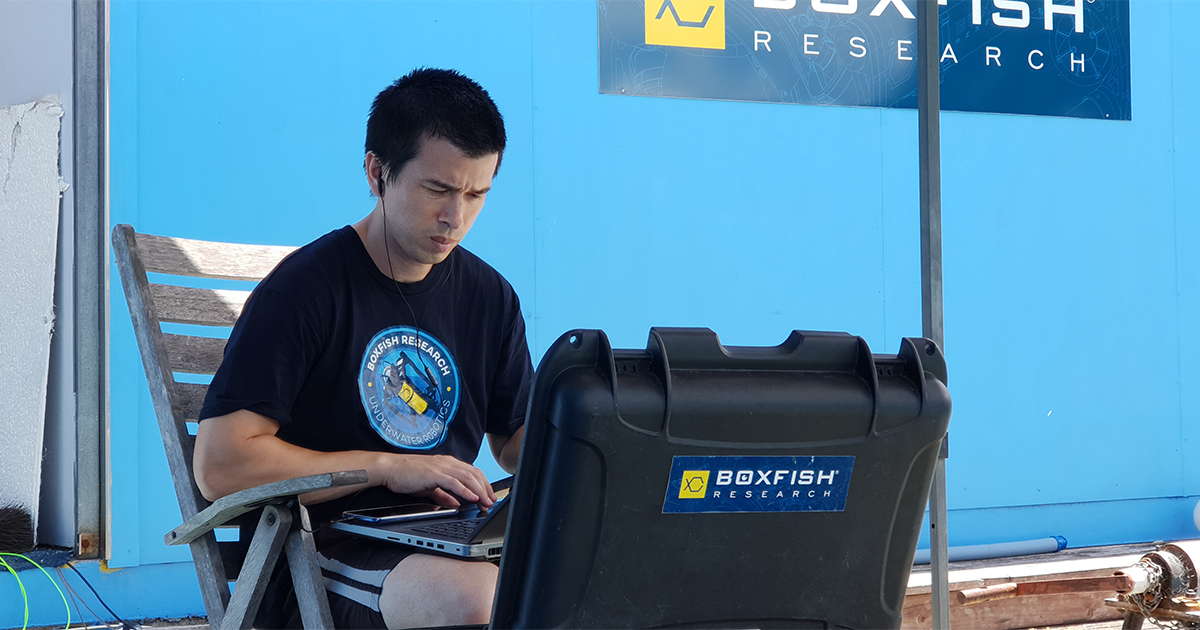 Jamie Bell, Lead R&D Robotics Engineer testing Boxfish Luna in the pool - ROV Robotics