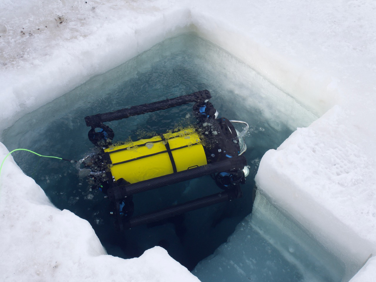 Launching the Boxfish ROV from a hole in the ice in Antarctica 2019