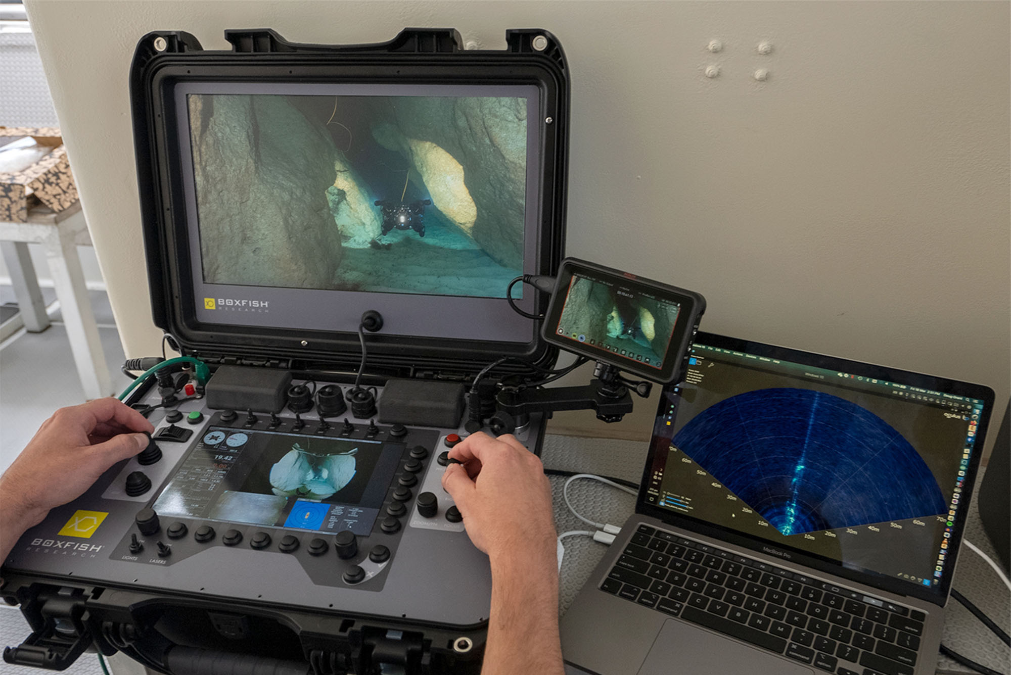 A photograph of a Boxfish ROV Control Console and Blueprint Subsea Oculus Sonar Display