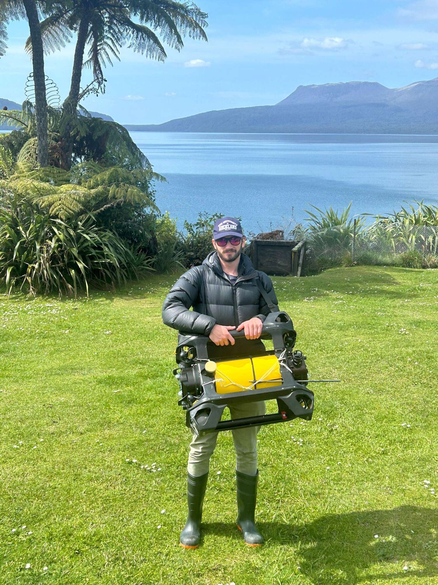 Douglas Grant holding autonomous AUV by Boxfish Robotics